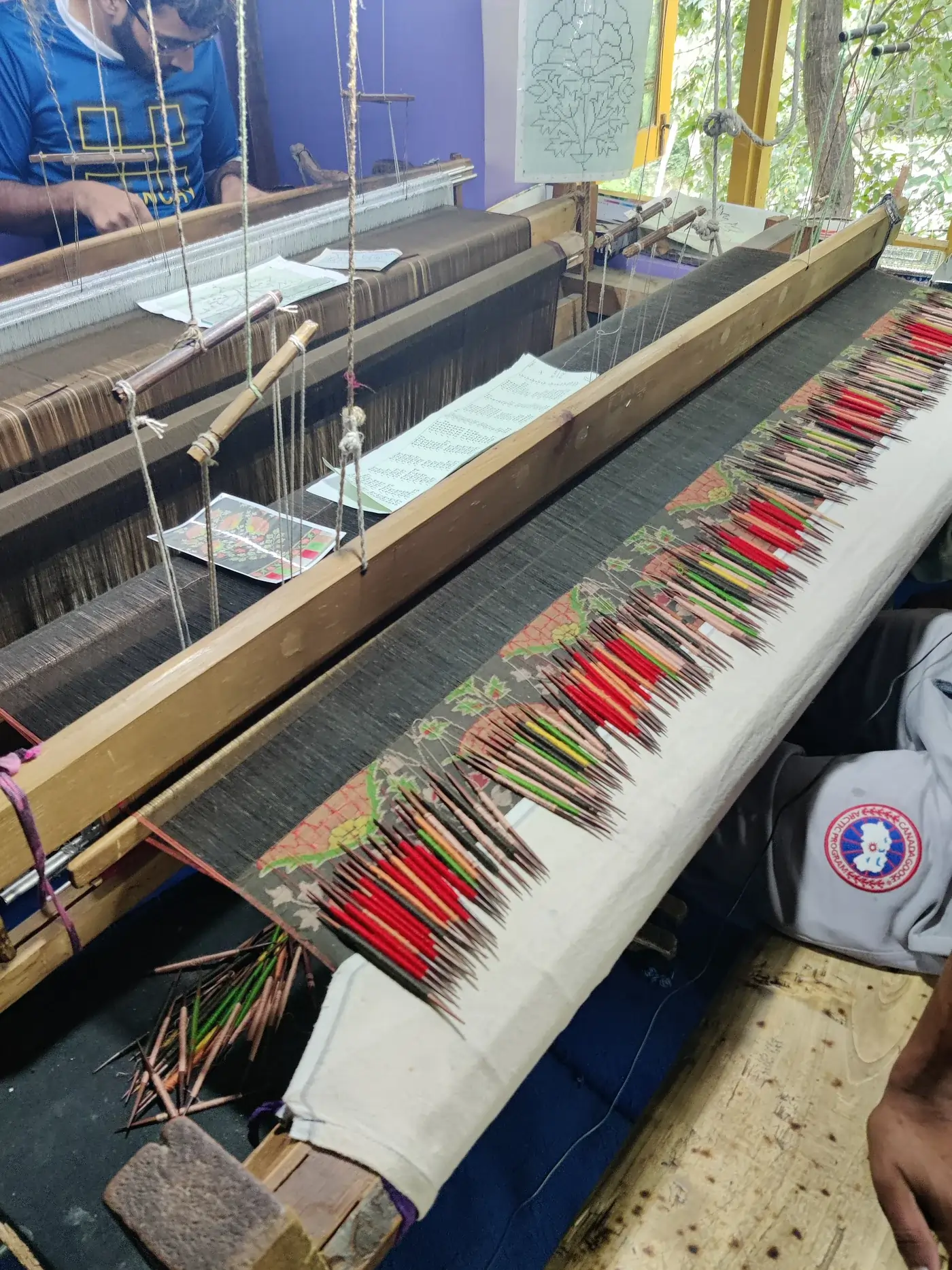 Kani weaver at the loom in Kanihama